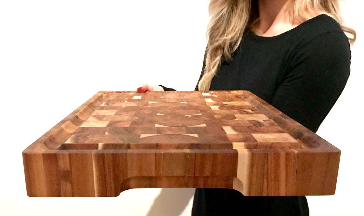Angled view of the board showing the end grain checkerboard and side handle groove
